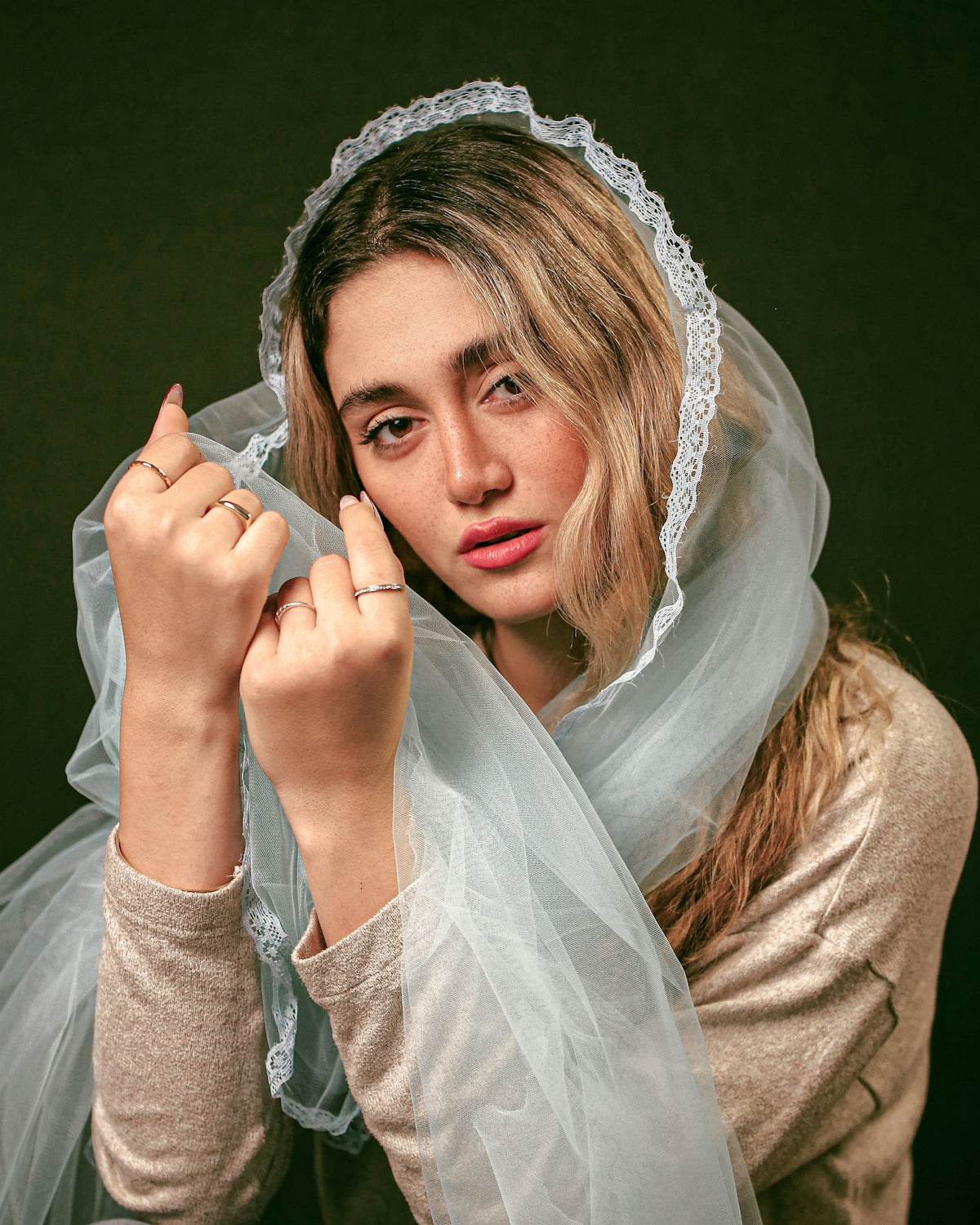 A woman with a veil on her head