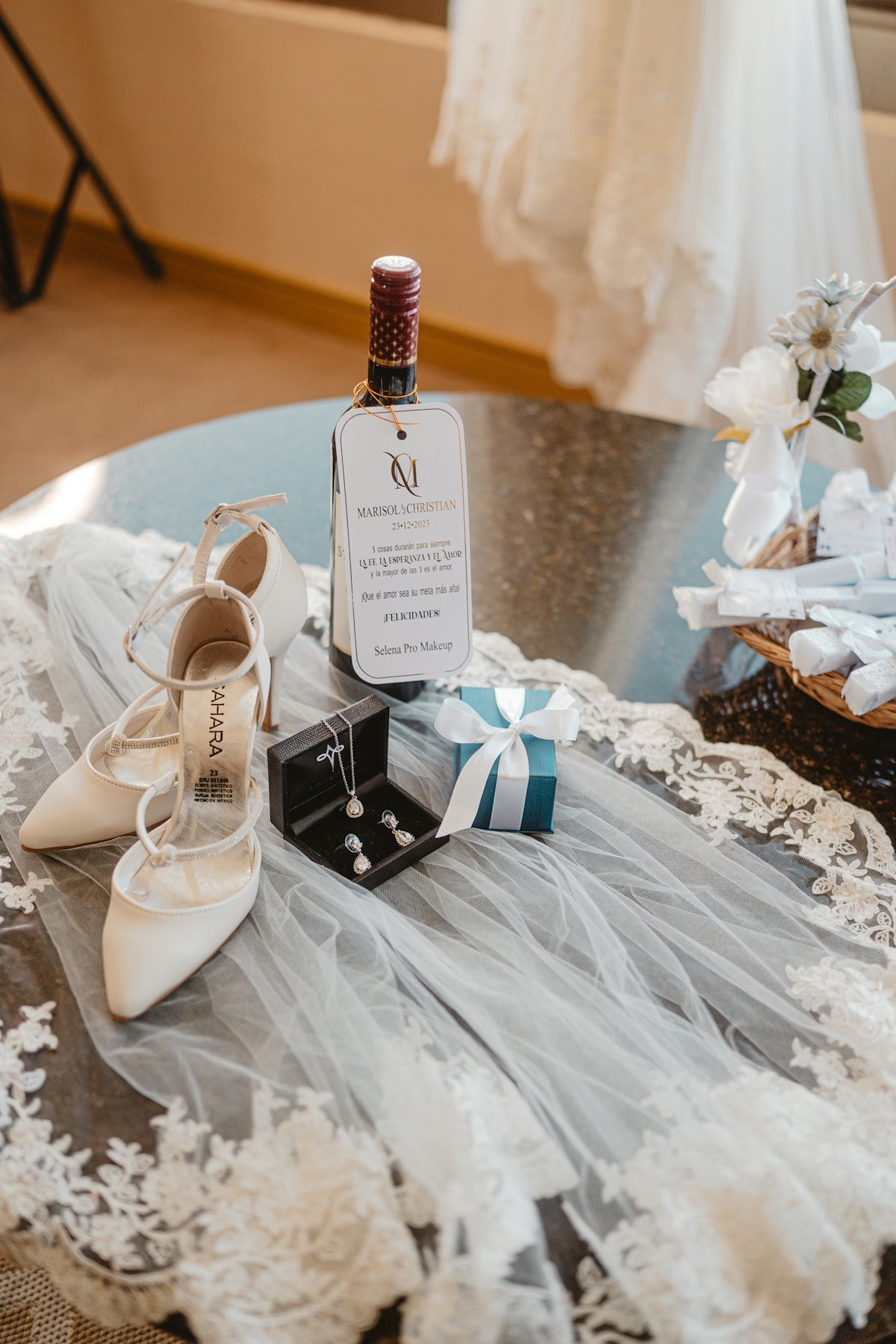 Wedding accessories including shoes, jewelry, and wine.
